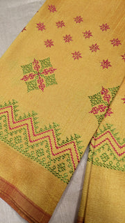 Yellow kasuti blouse front view highlighting stitched embroidery